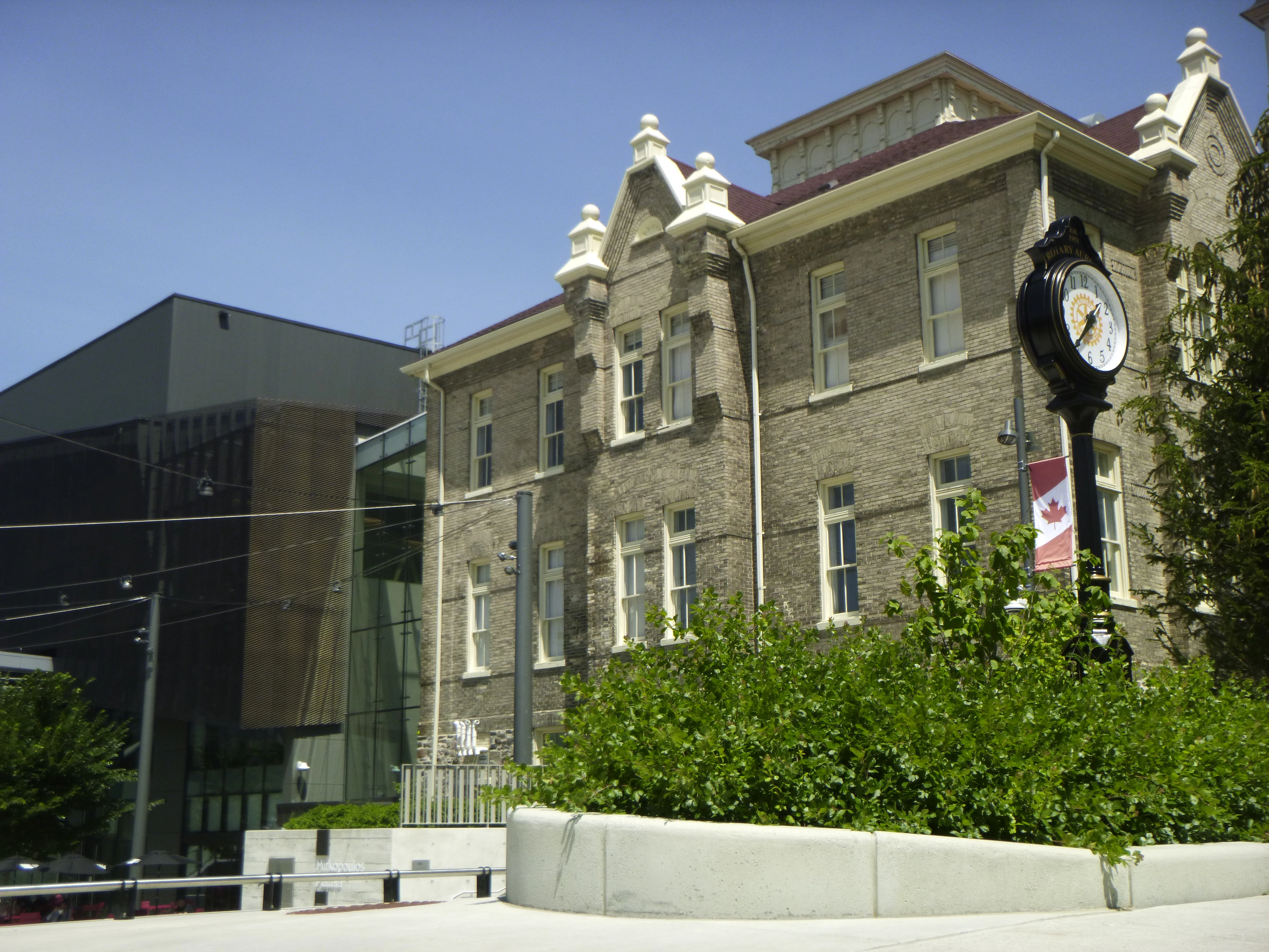 A photograph of Aurora Library Square centred between the Aurora Public Library and the Aurora Cultural Centre